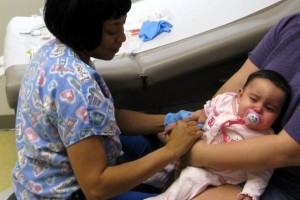 Nursing inserting an IV